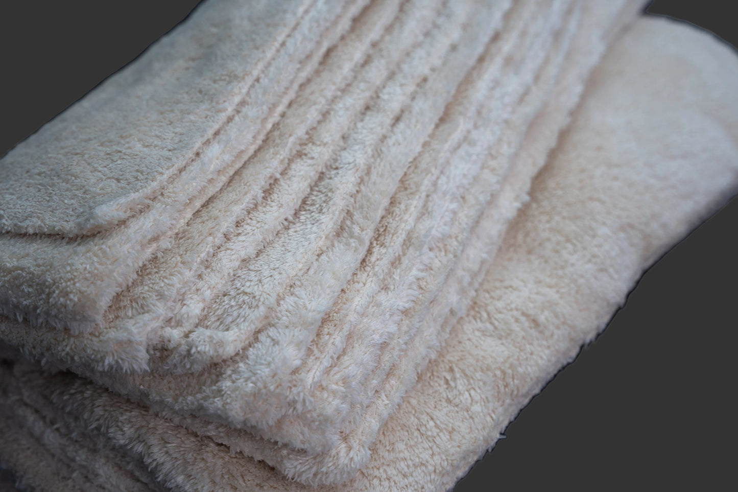 close up oh klin werks towel on grey background