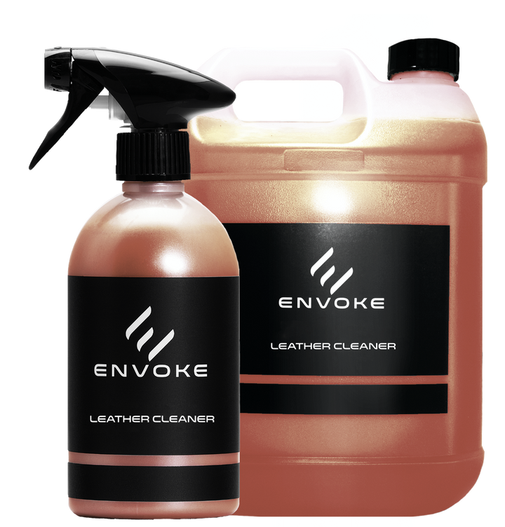two bottles of envoke leather cleaner on white background