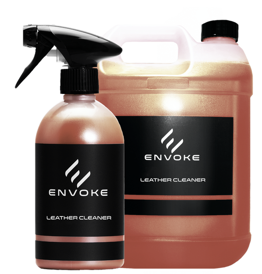 two bottles of envoke leather cleaner on white background